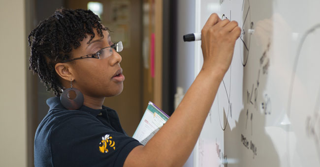 teacher writing on board